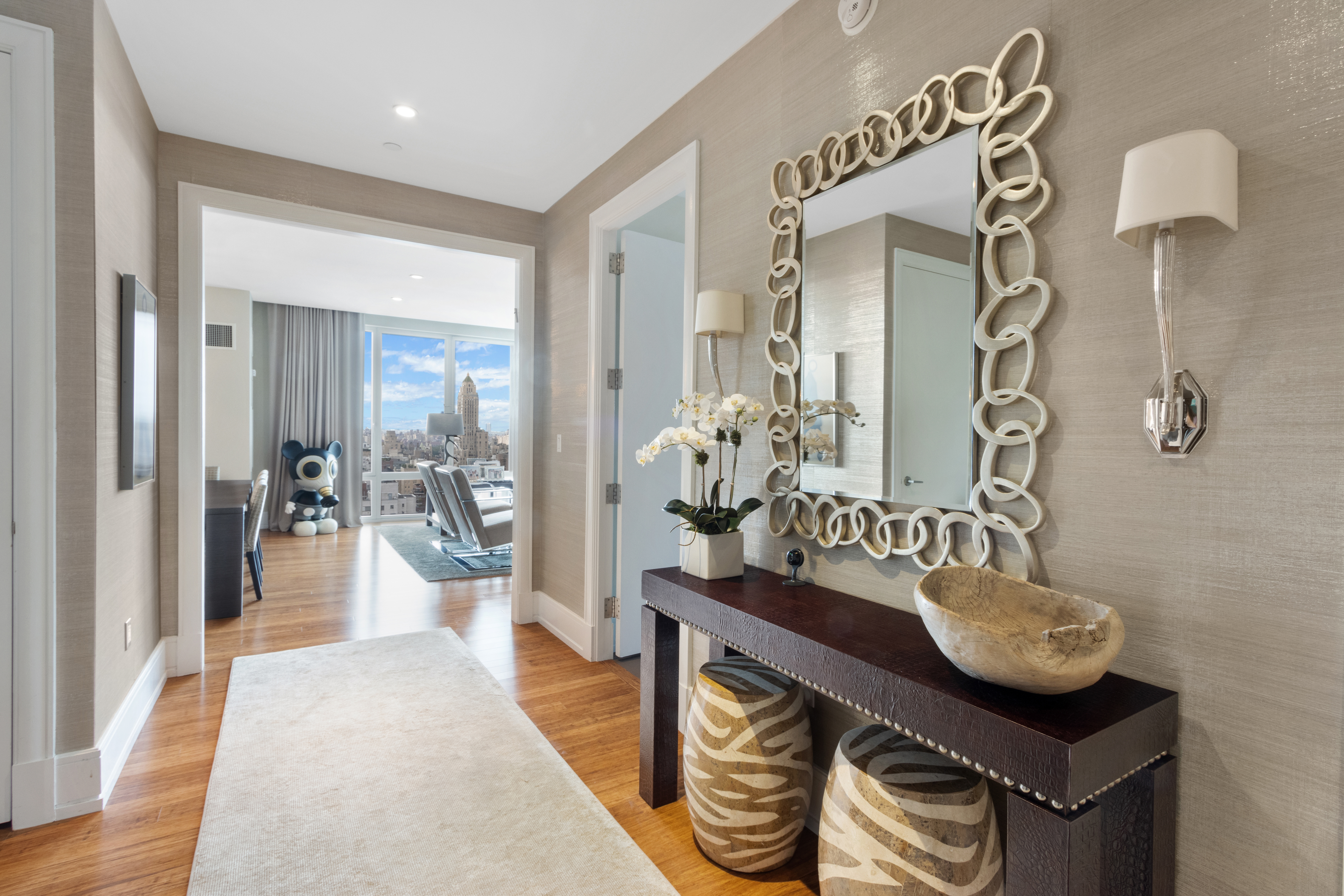 255 East 74th Street, Unit 25B Manhattan, NY 10021 - Photo 6 of 23 a dining room with furniture and chandelier