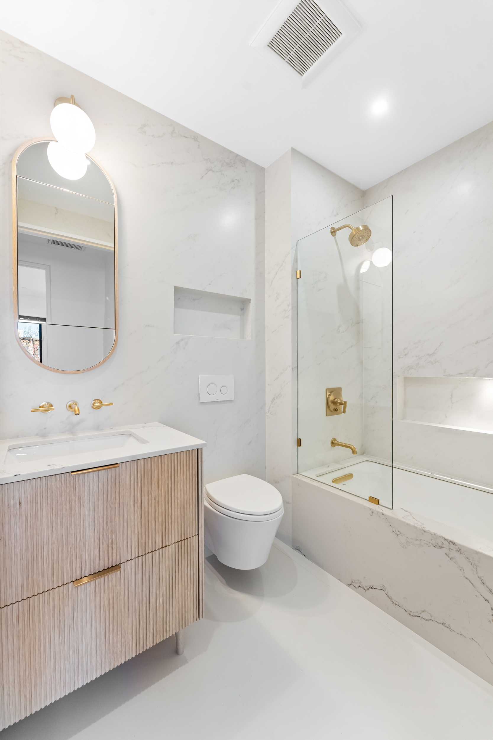 167 13th Street, Unit PH Brooklyn, NY 11215 - Photo 12 of 14 a bathroom with a double vanity sink toilet mirror and bathtub