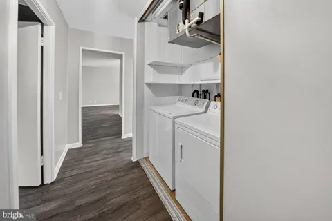 a kitchen with a refrigerator and a sink
