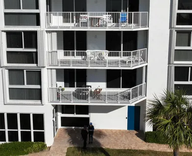 a front view of a building with many windows