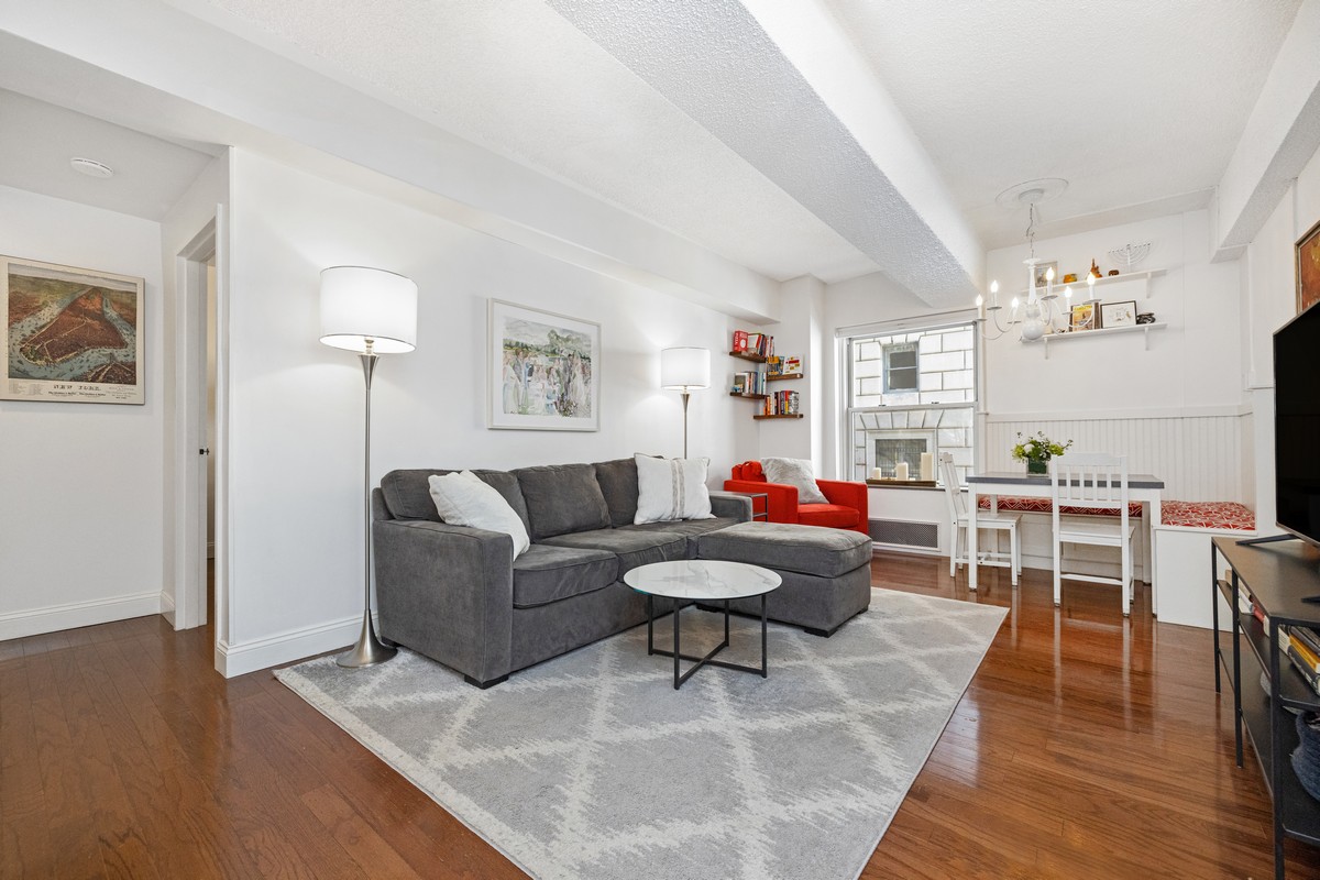 96 Schermerhorn Street, Unit 2F Brooklyn, NY 11201 - Photo 2 of 10 a living room with furniture a rug and a table