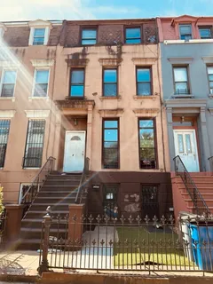 a front view of a multi story residential apartment building