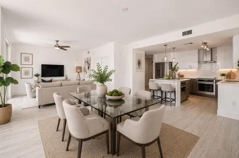 a view of a dining room with furniture window and wooden floor