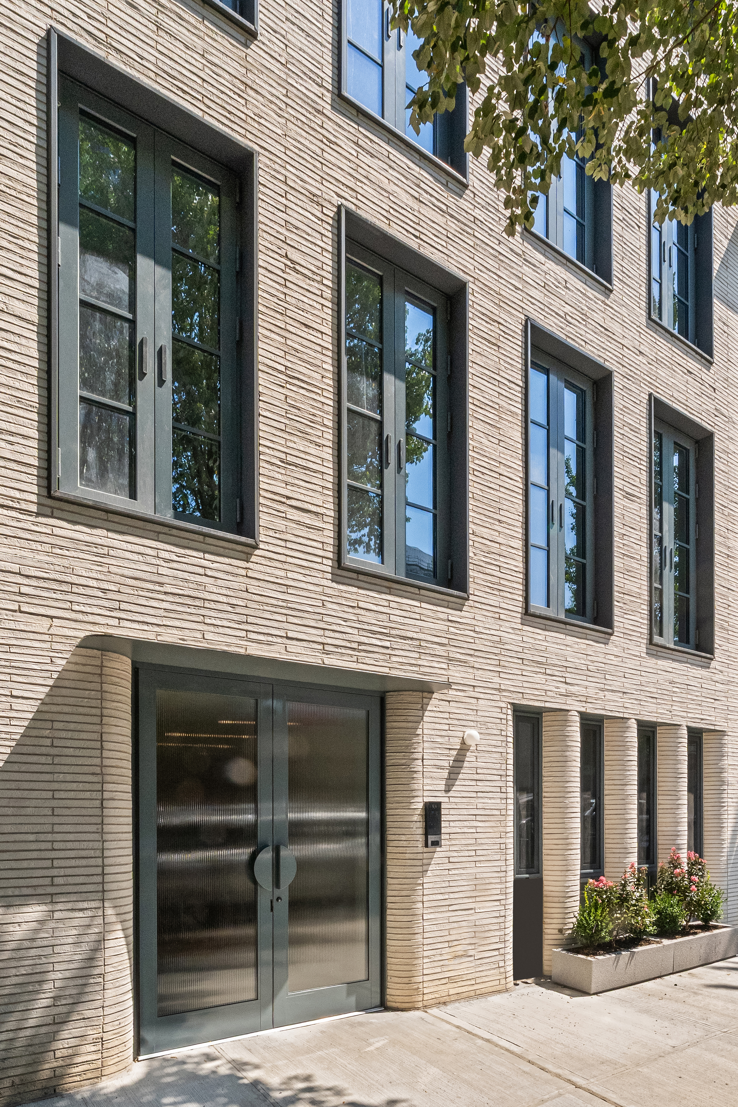 79 South 2nd Street, Unit 2 Brooklyn, NY 11249 - Photo 11 of 14 a view of building with a window and a tree