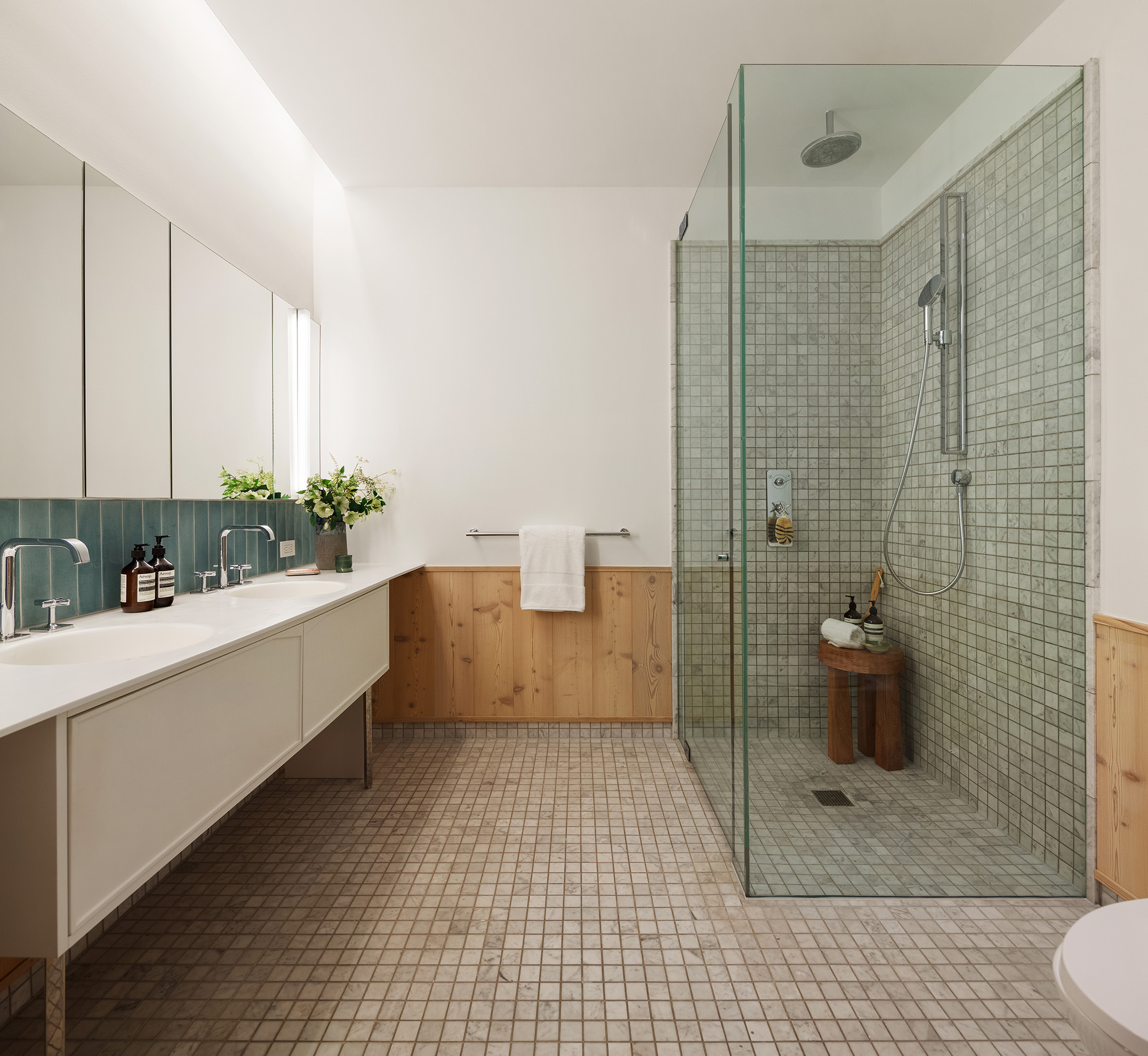 1 Avenue Of The Americas, Unit 2N Manhattan, NY 10013 - Photo 8 of 15 a bathroom with a shower a toilet a sink a mirror and vanity