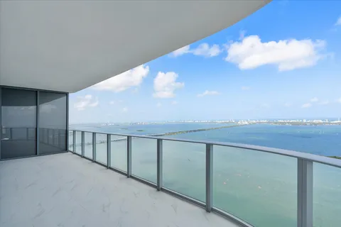 a view of balcony with furniture