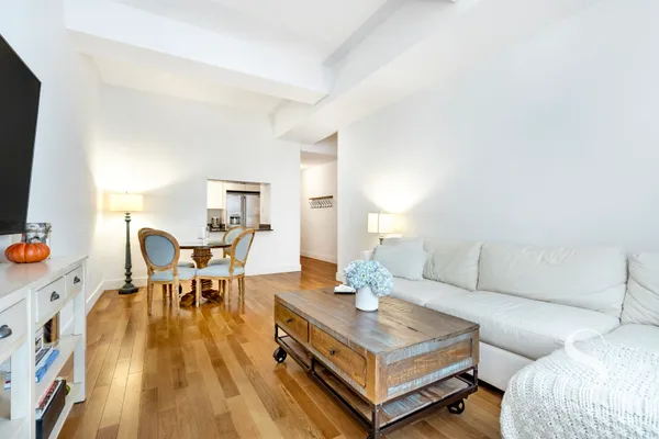 a living room with furniture and a table