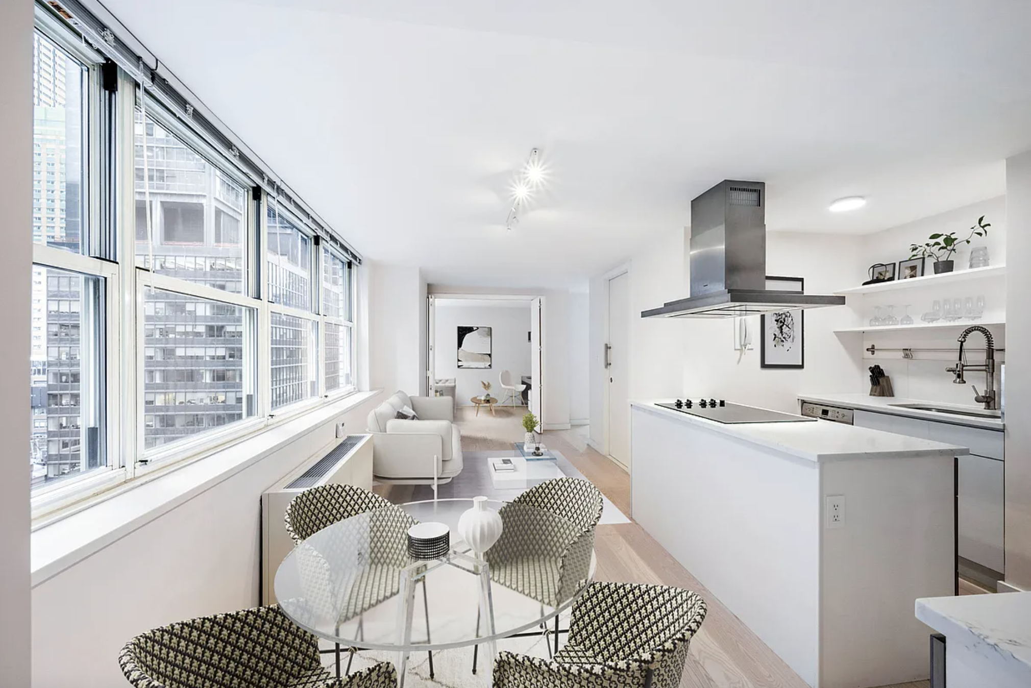 159 East 53rd Street, Unit 10A Manhattan, NY 10022 - Photo 2 of 10 a living room with furniture a dining table and chairs with wooden floor