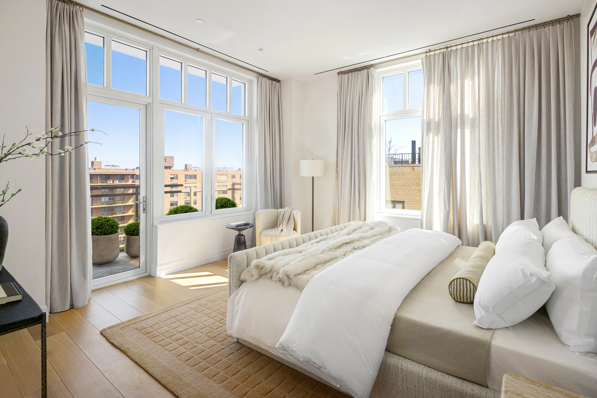 15 West 96th Street, Unit 19 Manhattan, NY 10025 - Photo 4 of 17 a bed sitting in a spacious bedroom next to a window