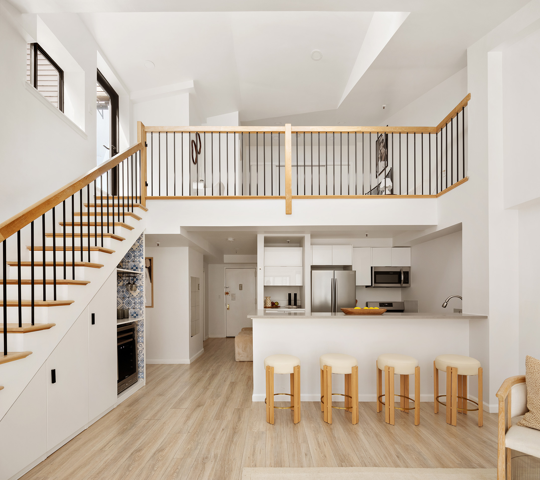136-140 West 23rd Street, Unit PHD Manhattan, NY 10011 - Photo 9 of 15 a kitchen with furniture and wooden floor
