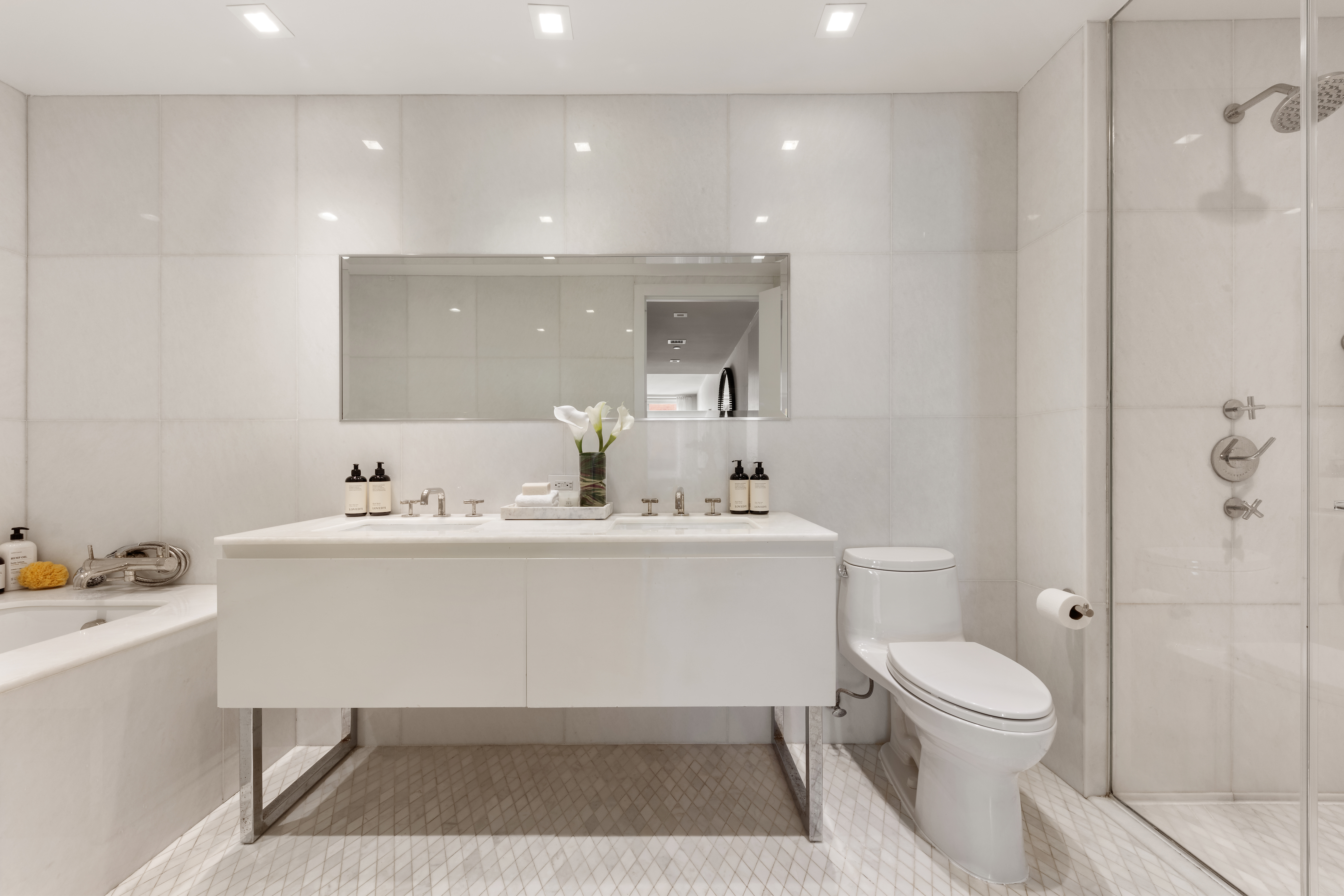 5 Franklin Place, Unit 3A Manhattan, NY 10013 - Photo 5 of 17 a bathroom with a sink toilet and shower