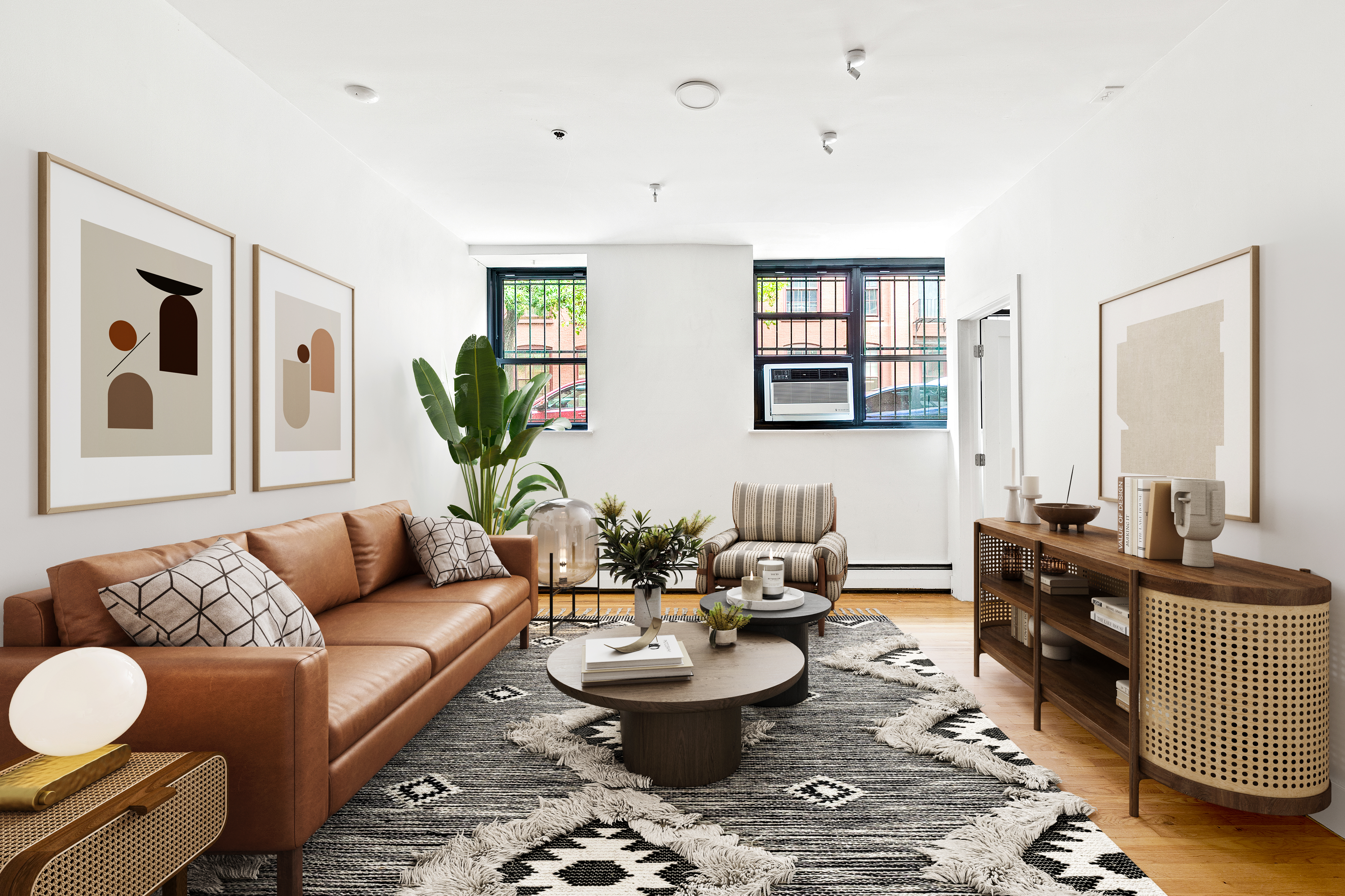 a living room with furniture and wooden floor