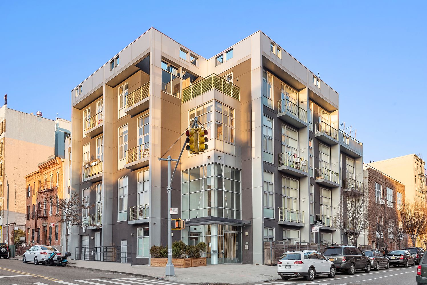 390 Lorimer Street, Unit 3H Brooklyn, NY 11206 - Photo 12 of 13 a city street lined with buildings and cars