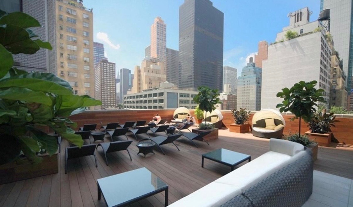 303 East 57th Street, Unit 44G Manhattan, NY 10022 - Photo 19 of 19 a view of a roof deck with couches and potted plants