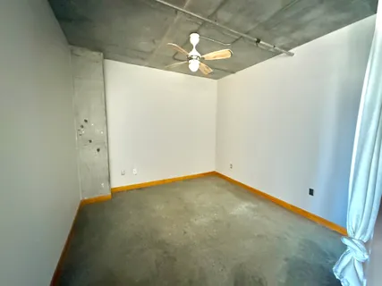 a living room with patio furniture and a table