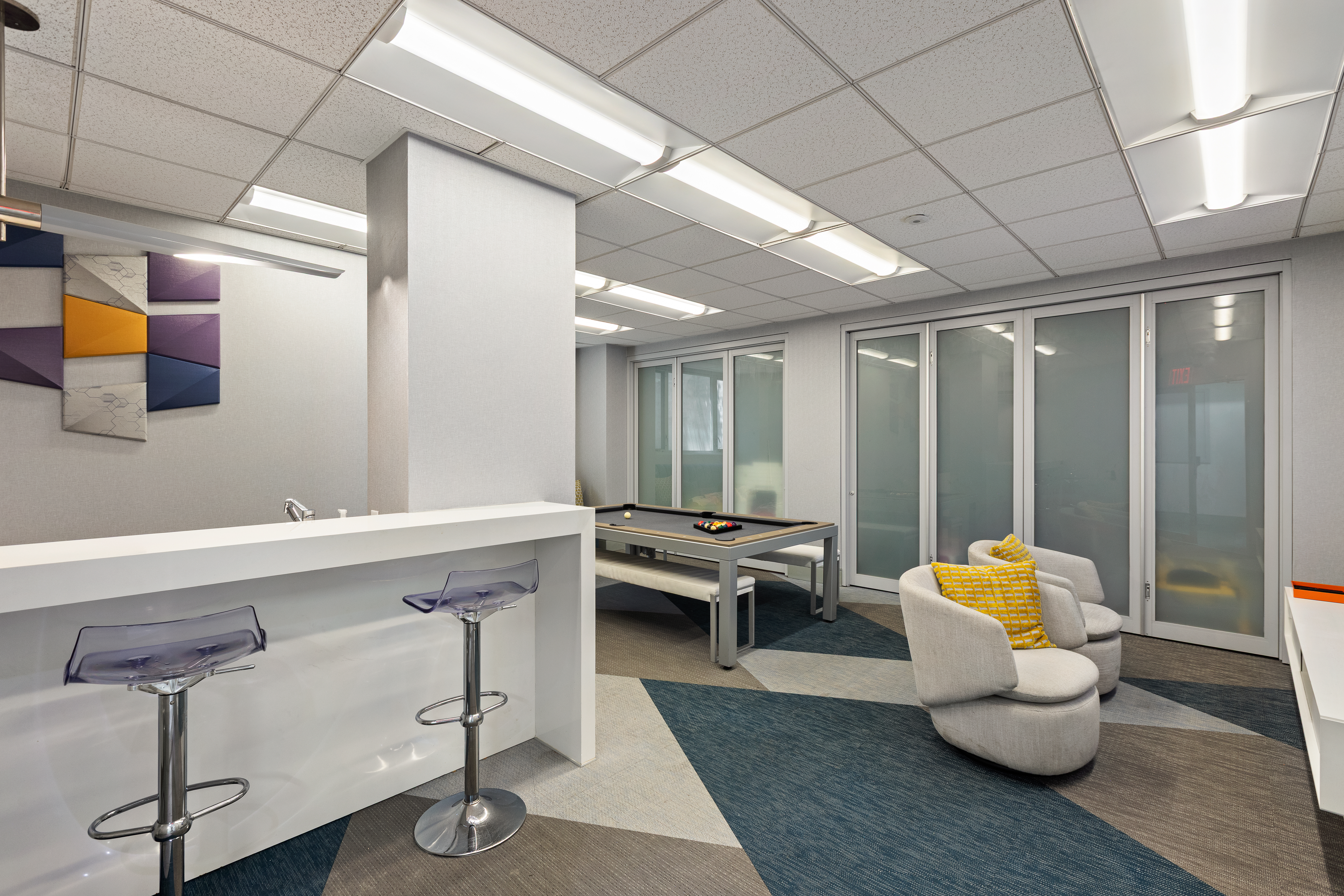 2 5th Avenue, Unit 5F Manhattan, NY 10011 - Photo 8 of 9 a hallway with furniture and wooden floor