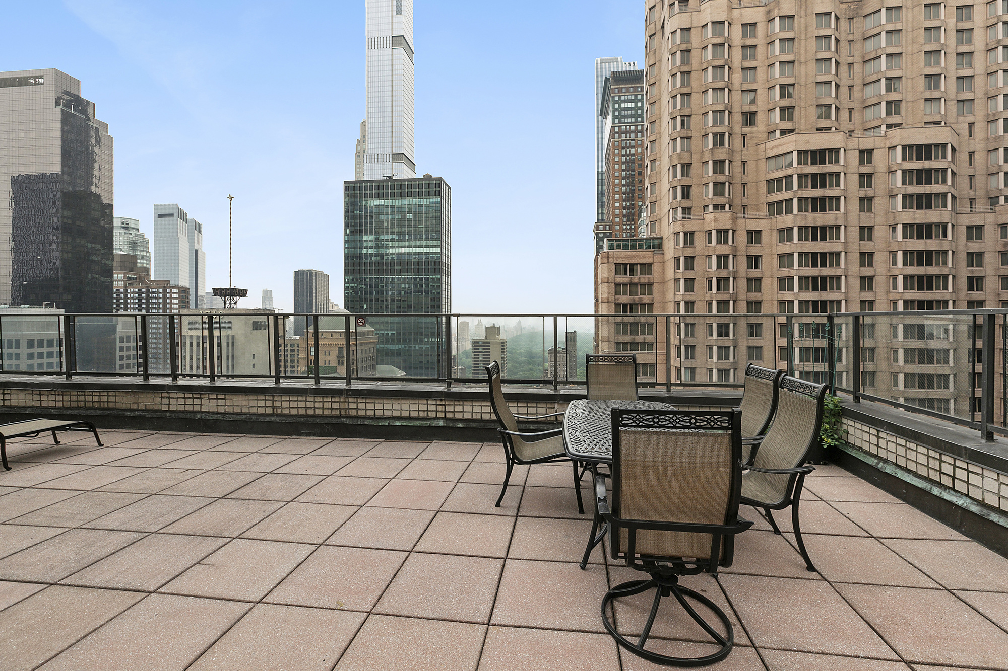 159 West 53rd Street, Unit 11D Manhattan, NY 10019 - Photo 6 of 9 a view of a terrace with chairs