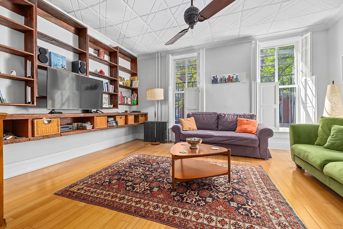 155 Luquer Street, Unit 1 Brooklyn, NY 11231 - Photo 9 of 13 a living room with furniture and a rug