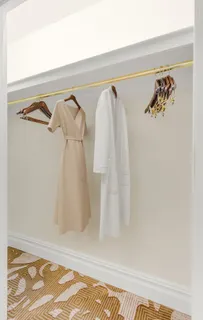 a room with wooden floor and furniture