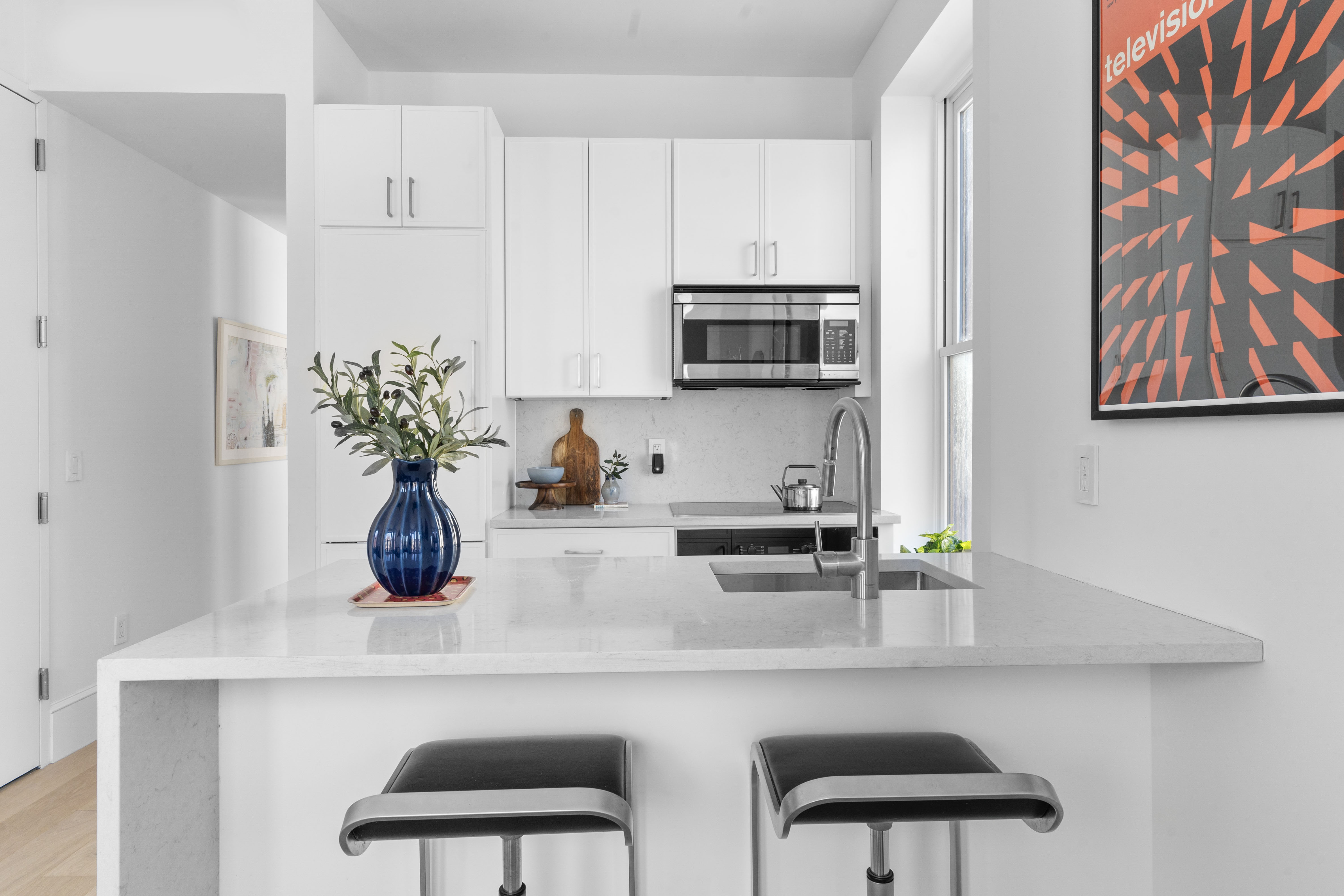1370 Dean Street, Unit B Brooklyn, NY 11216 - Photo 4 of 8 a kitchen with appliances a sink and cabinets