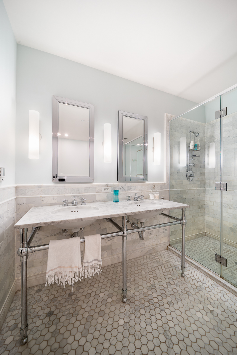 481 Washington Street, Unit 6N Manhattan, NY 10013 - Photo 8 of 10 a view of a bathroom sink and a mirror