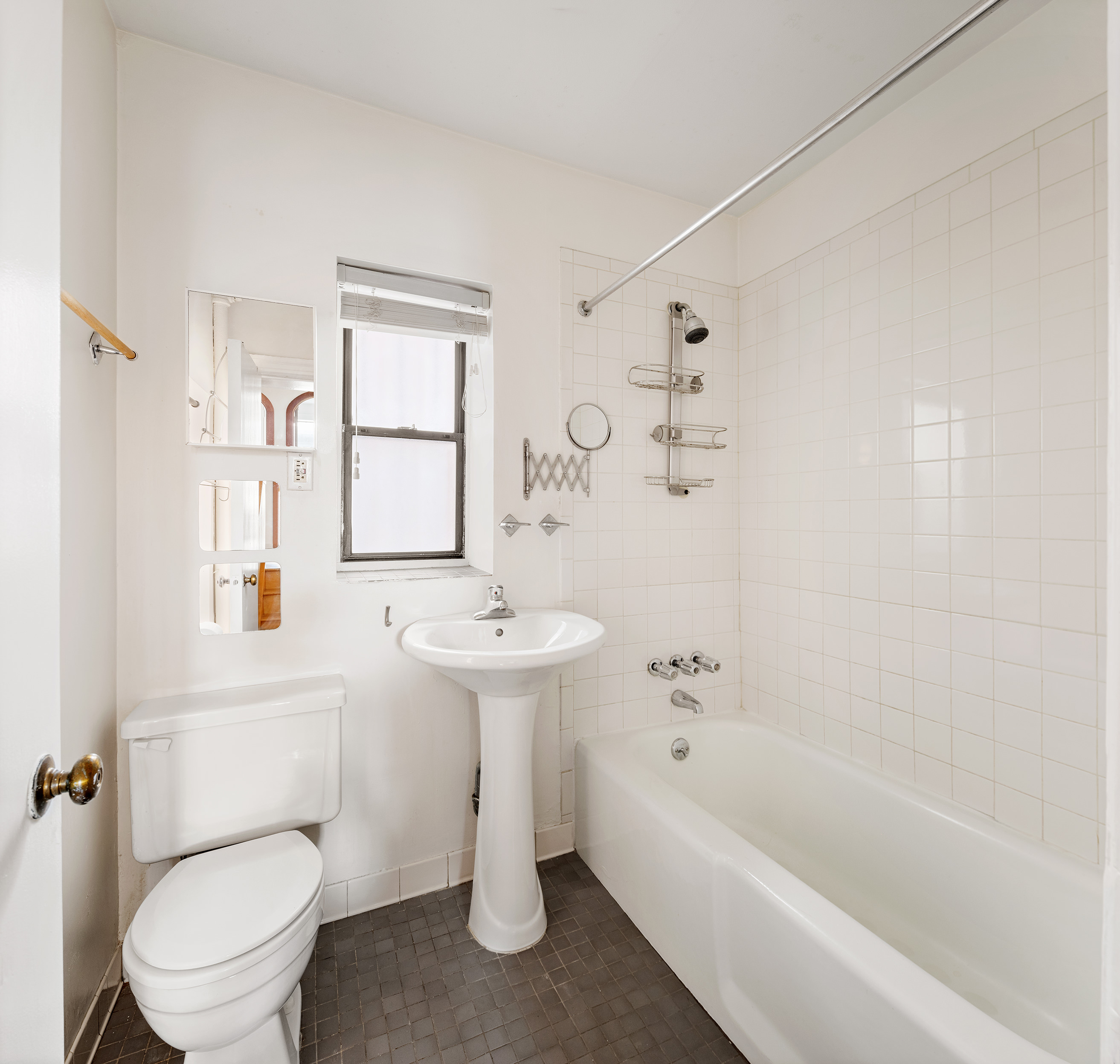 295 East 8th Street, Unit 2/3E Manhattan, NY 10009 - Photo 18 of 23 a bathroom with a sink a toilet and bathtub