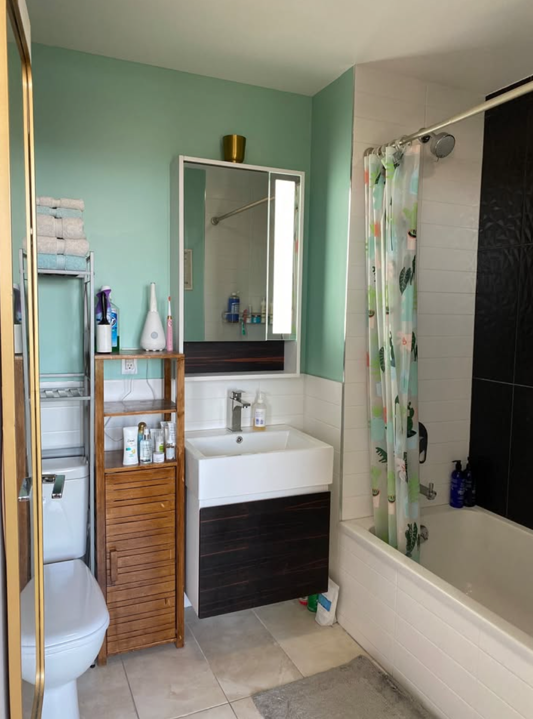 4907 4th Avenue, Unit 7A Brooklyn, NY 11220 - Photo 7 of 13 a bathroom with a sink a toilet and shower