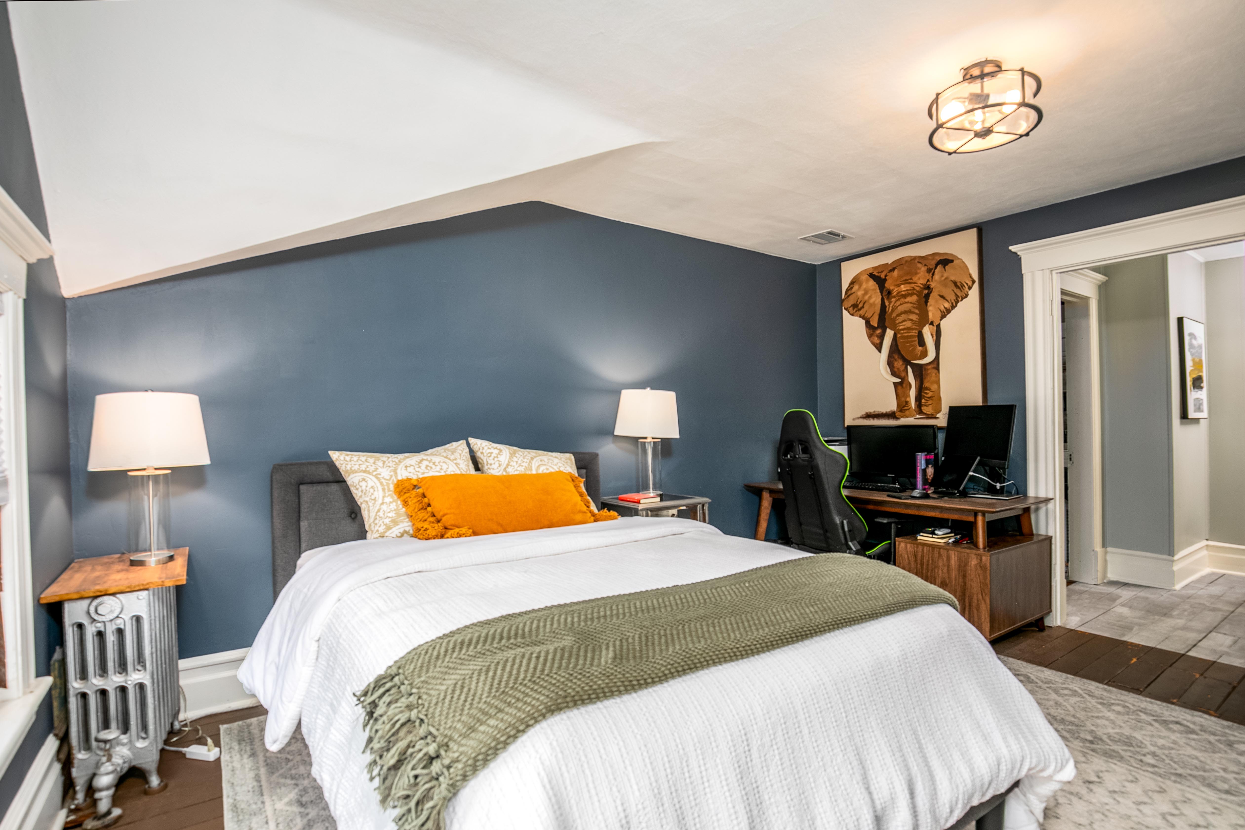 163 Ridge Road Rutherford, NJ 07070 - Photo 39 of 59 a bedroom with a bed and a lamp on table
