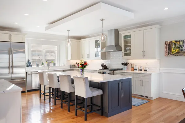 a kitchen with lots of counter top space and dining table