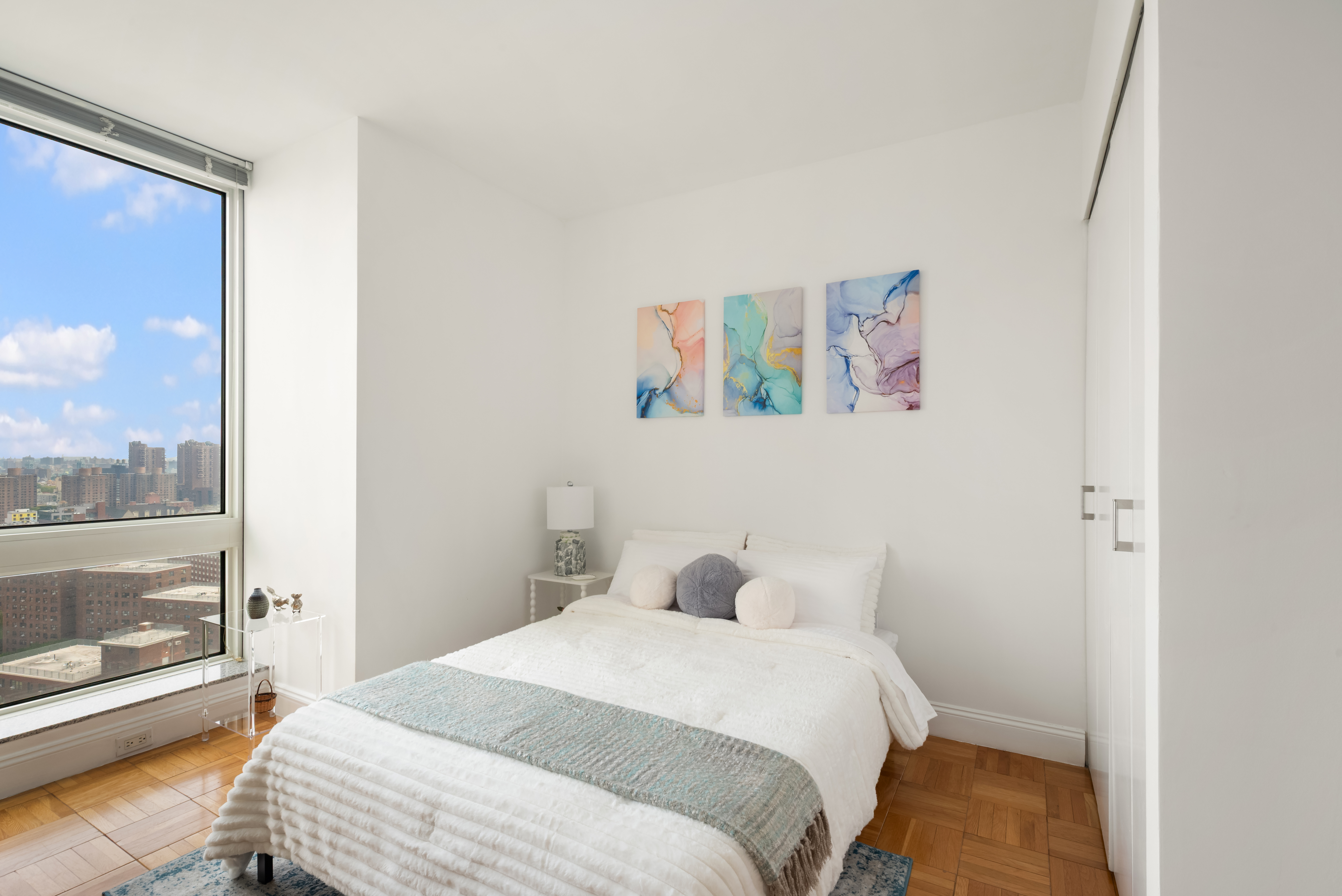 215-217 East 96th Street, Unit 25B Manhattan, NY 10128 - Photo 2 of 19 a bedroom with a bed and a window