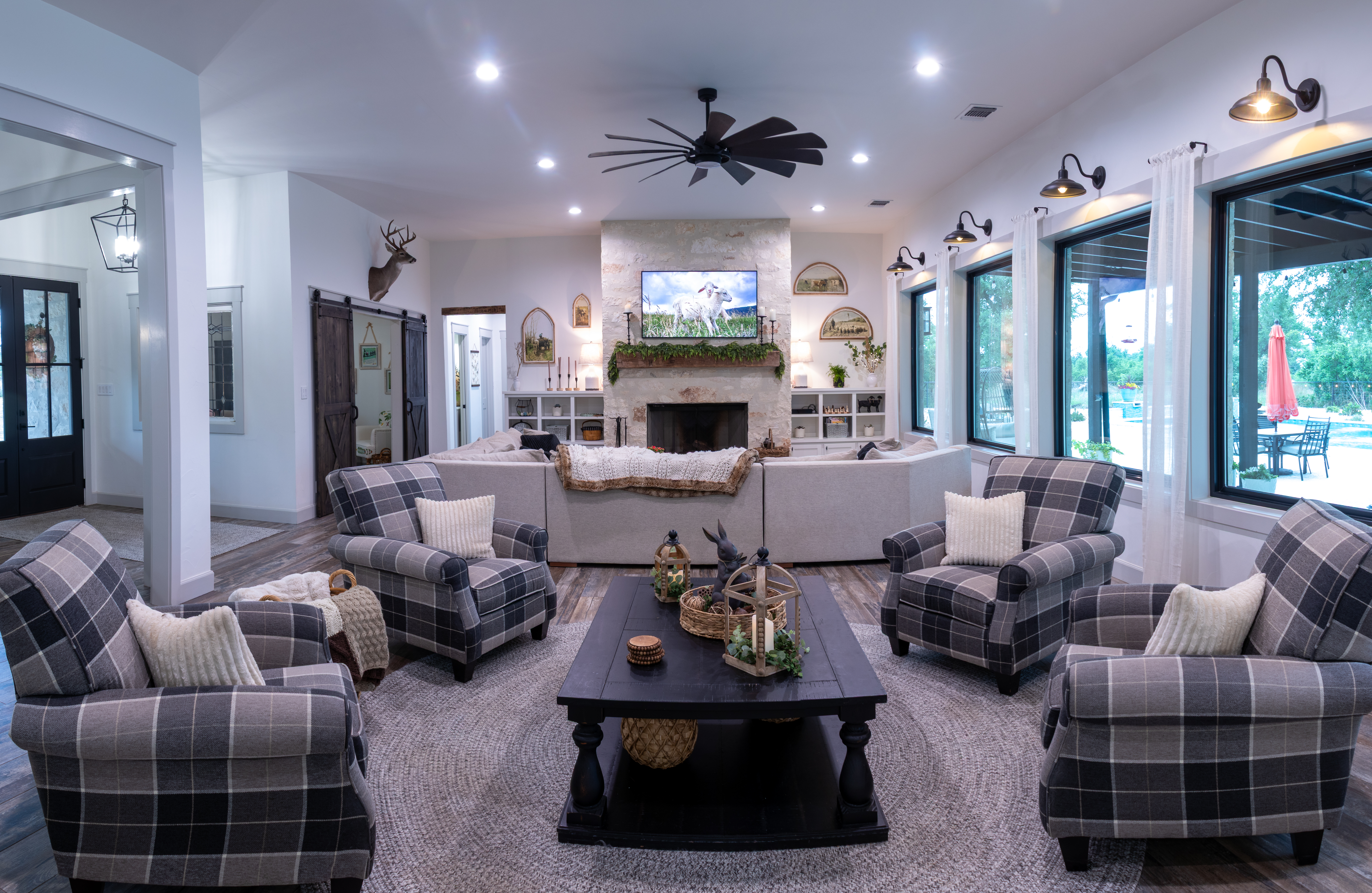 272 Slate Rock Road Willow City, TX 78675 - Photo 12 of 30 a living room with furniture fireplace and a large window