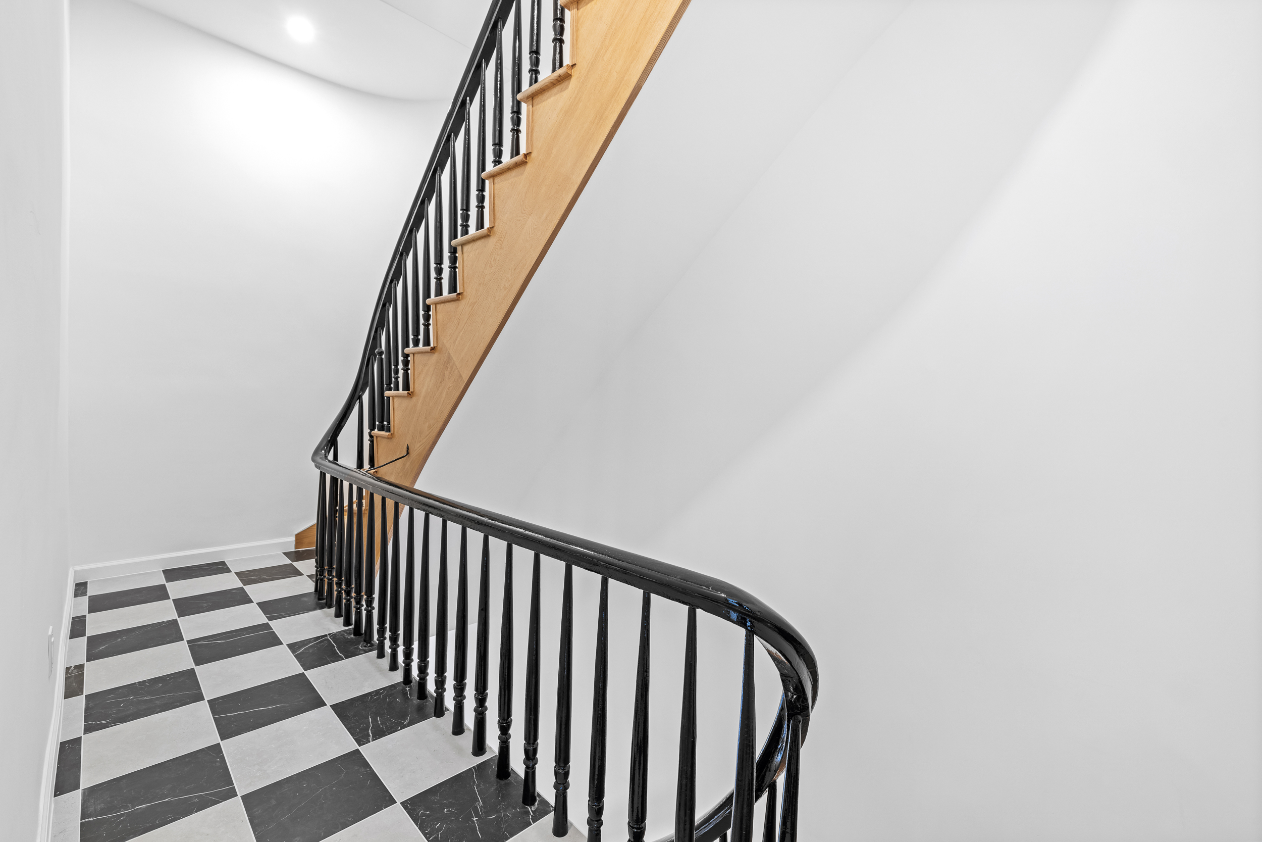 317 Court Street, Unit 3 Brooklyn, NY 11231 - Photo 13 of 15 a view of a hallway with wooden floor and a black and white checkered floor
