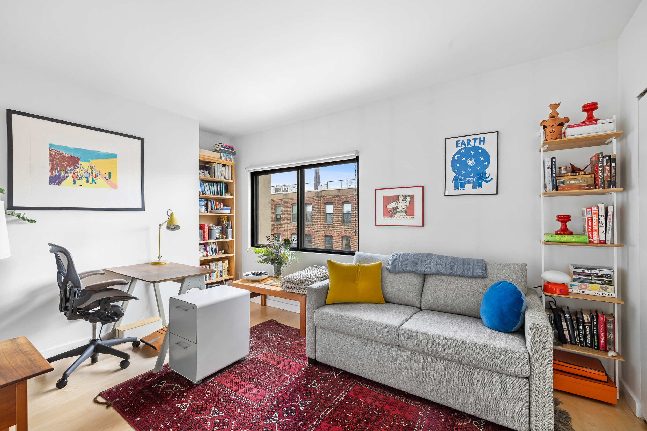 20 Tiffany Place, Unit 6N Brooklyn, NY 11231 - Photo 8 of 12 a living room with furniture a rug and a large window