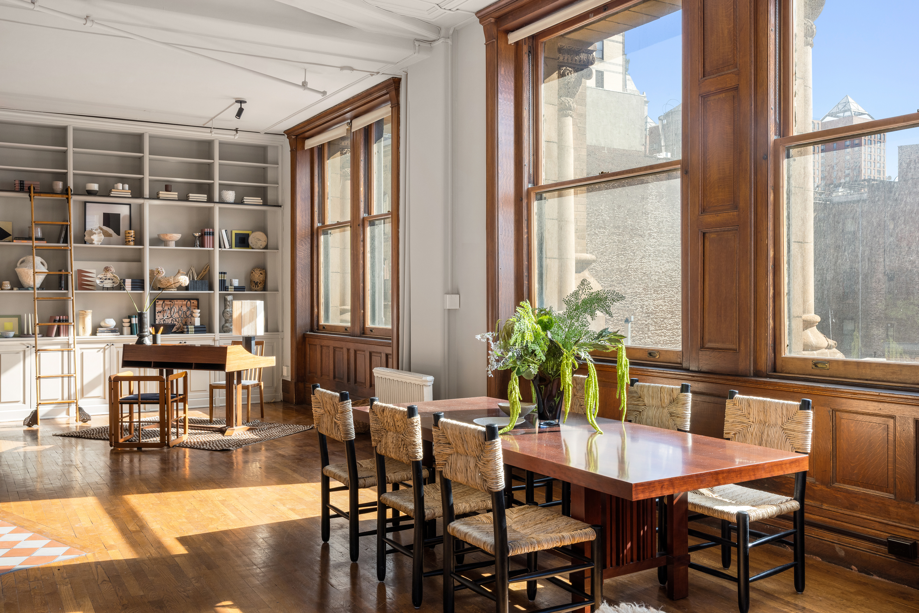 874 Broadway, Unit 501 Manhattan, NY 10003 - Photo 6 of 17 a view of a dining room with furniture window and wooden floor