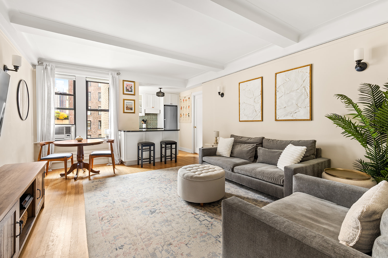 41 West 72nd Street, Unit 10B Manhattan, NY 10023 - Photo 1 of 7 a living room with furniture and a fireplace