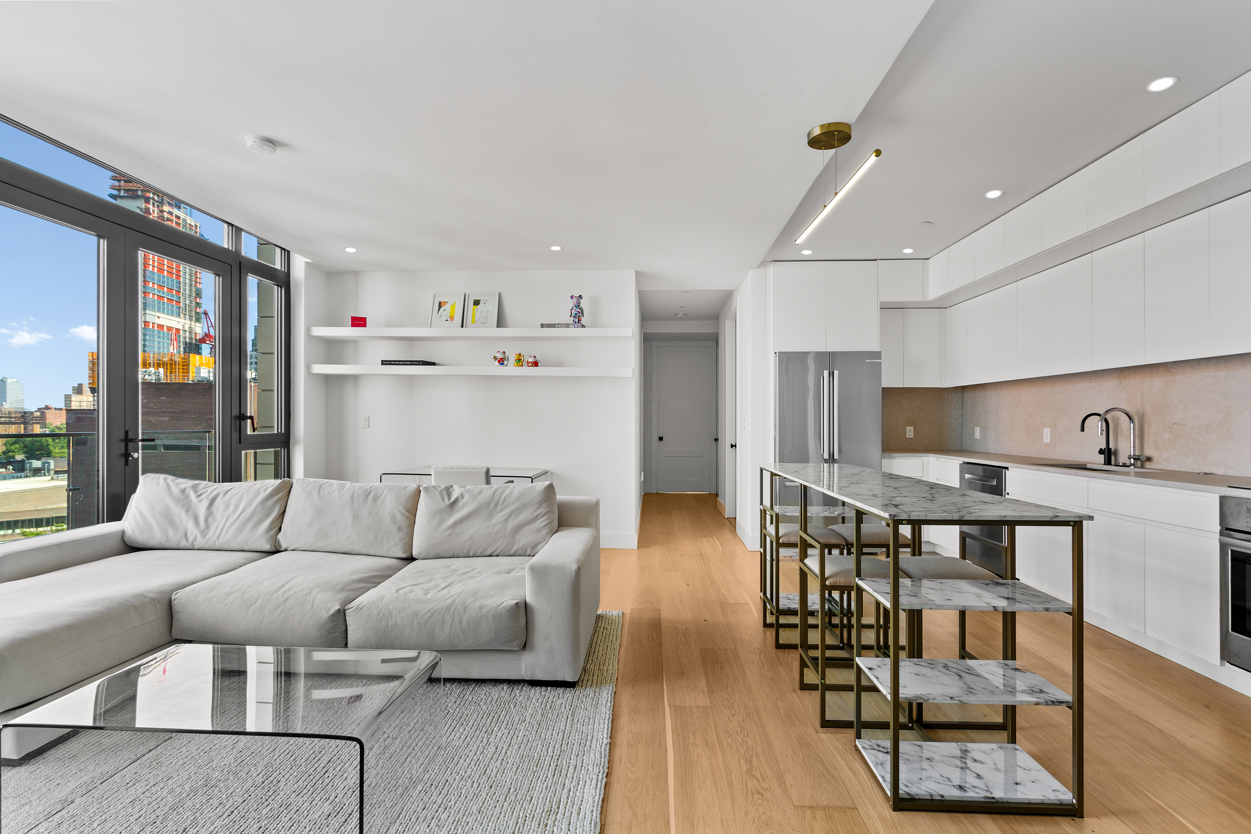 112 Fleet Place, Unit 12A Brooklyn, NY 11201 - Photo 1 of 15 a living room with furniture and wooden floor