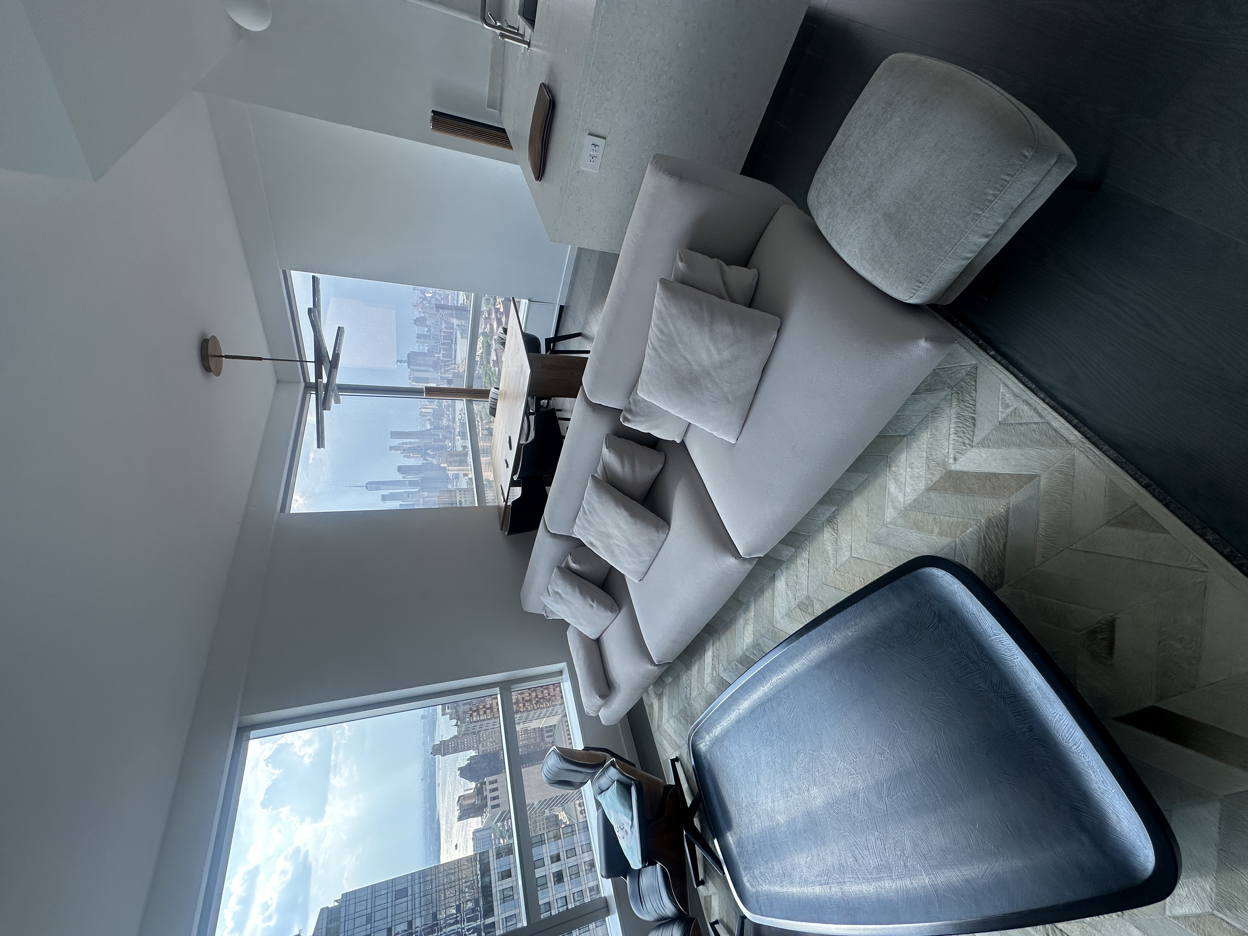 1 City Point, Unit 57A Brooklyn, NY 11201 - Photo 22 of 23 a living room with furniture and a large window