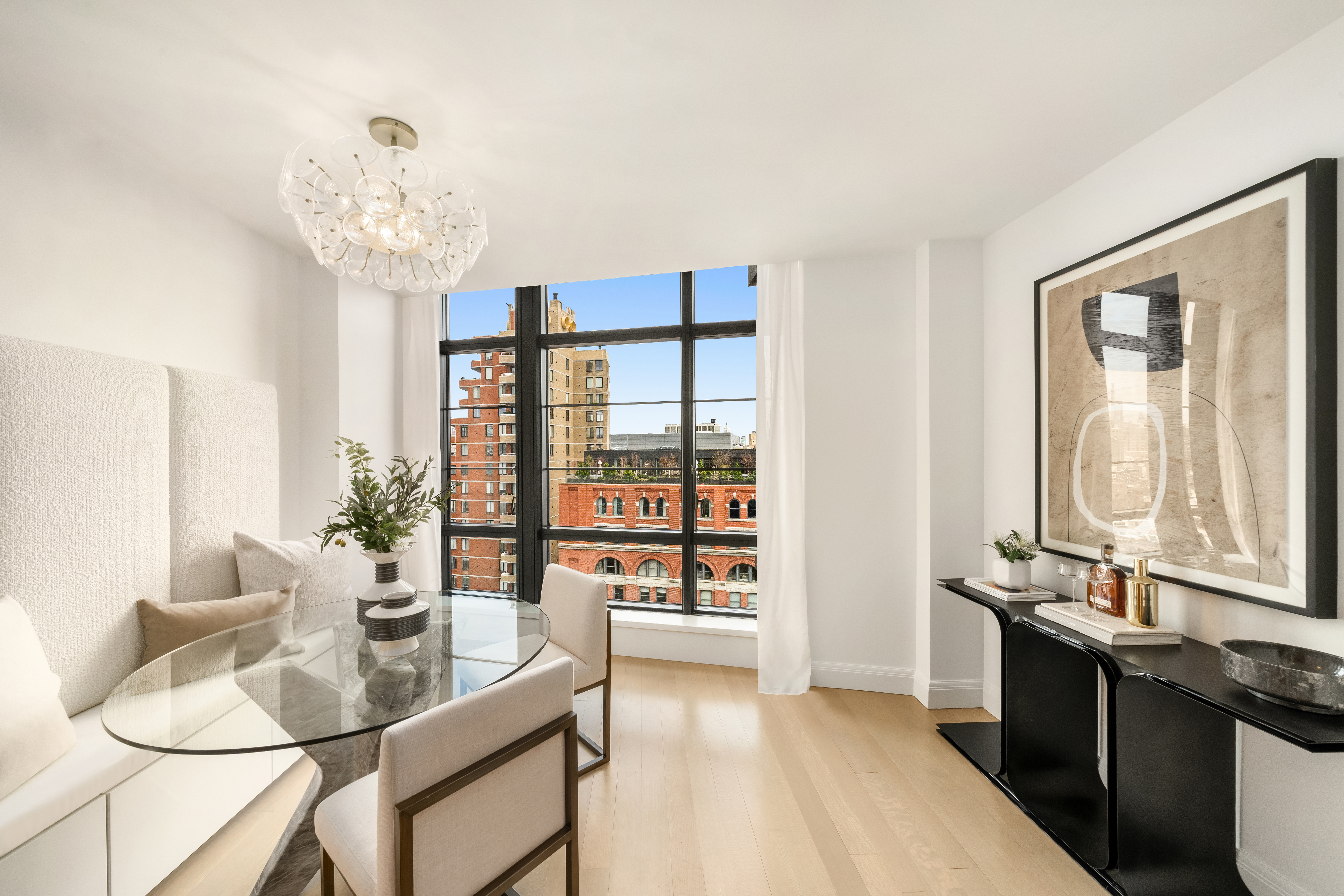 150 Charles Street, Unit 14B Manhattan, NY 10014 - Photo 5 of 20 a dining room with wooden floor and large windows