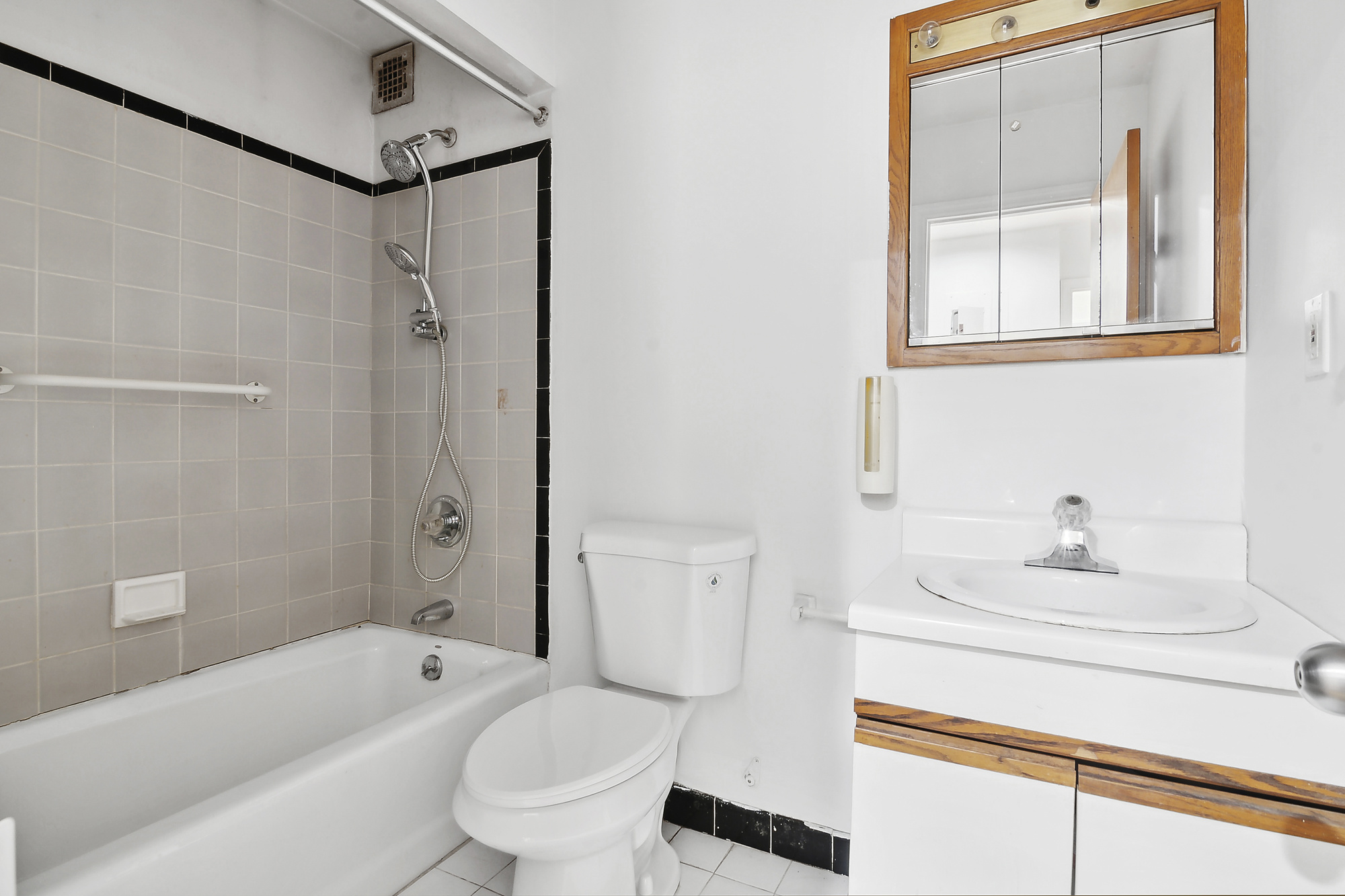426 13th Street, Unit 2C Brooklyn, NY 11215 - Photo 8 of 13 a bathroom with a sink toilet and shower