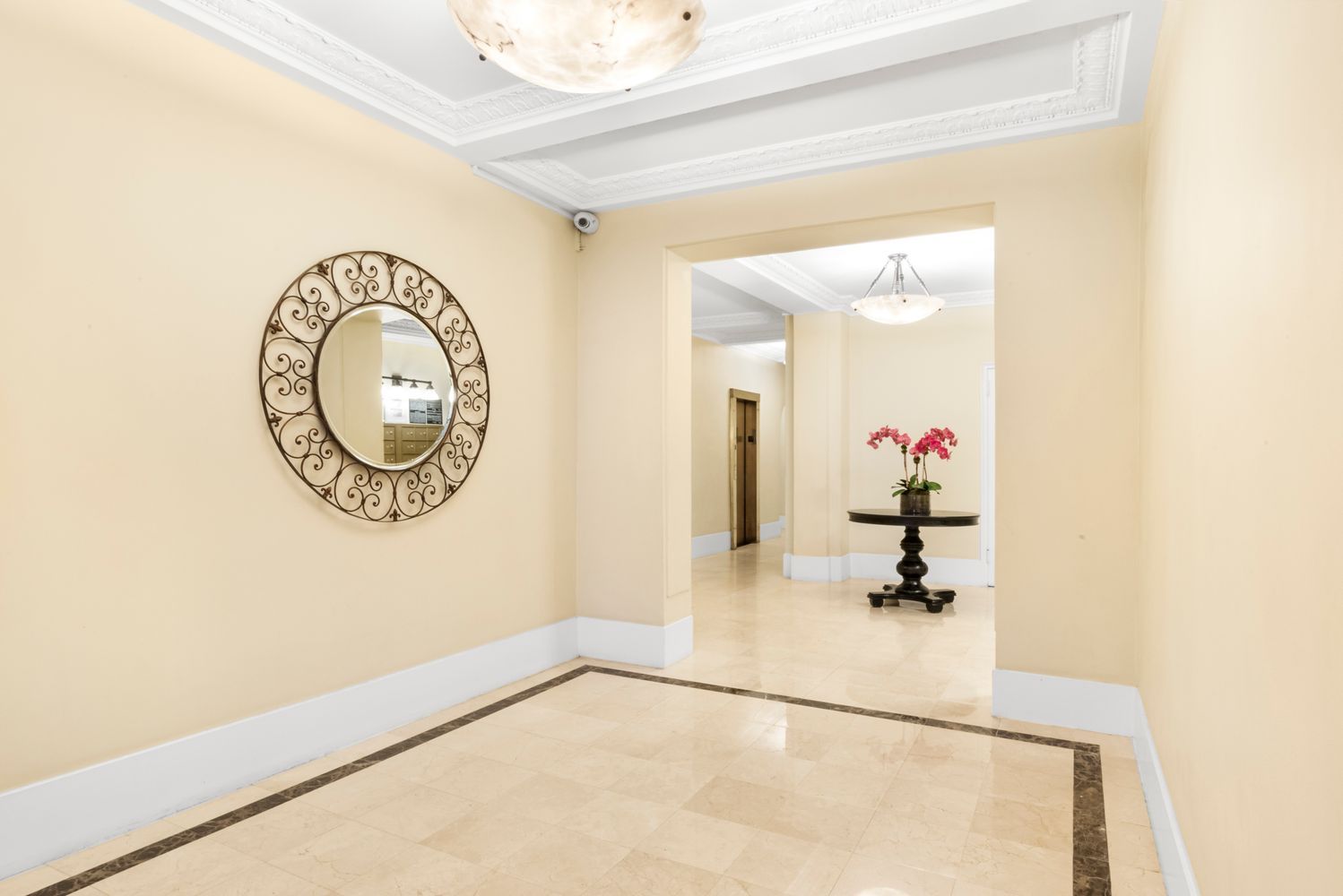 114 West 70th Street Manhattan, NY 10023 - Photo 7 of 9 a view of a room with wooden floor and white wall
