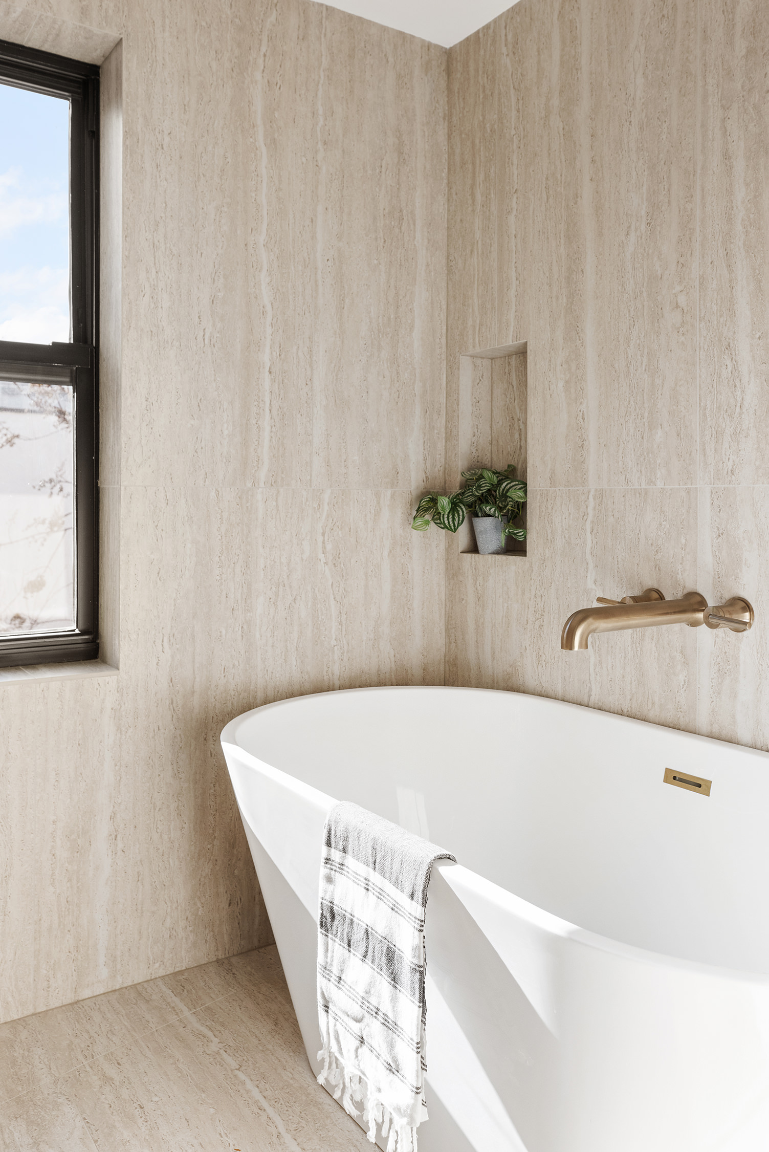 90 Putnam Avenue Brooklyn, NY 11238 - Photo 8 of 15 a bath tub sitting in a bathroom next to a window