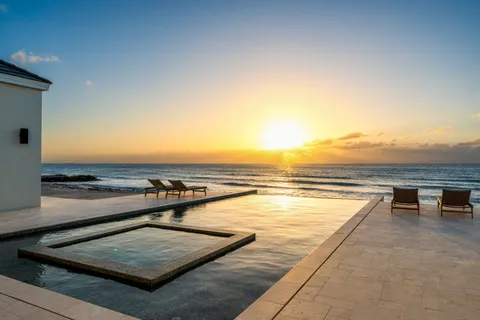 a view of a swimming pool with an outdoor seating