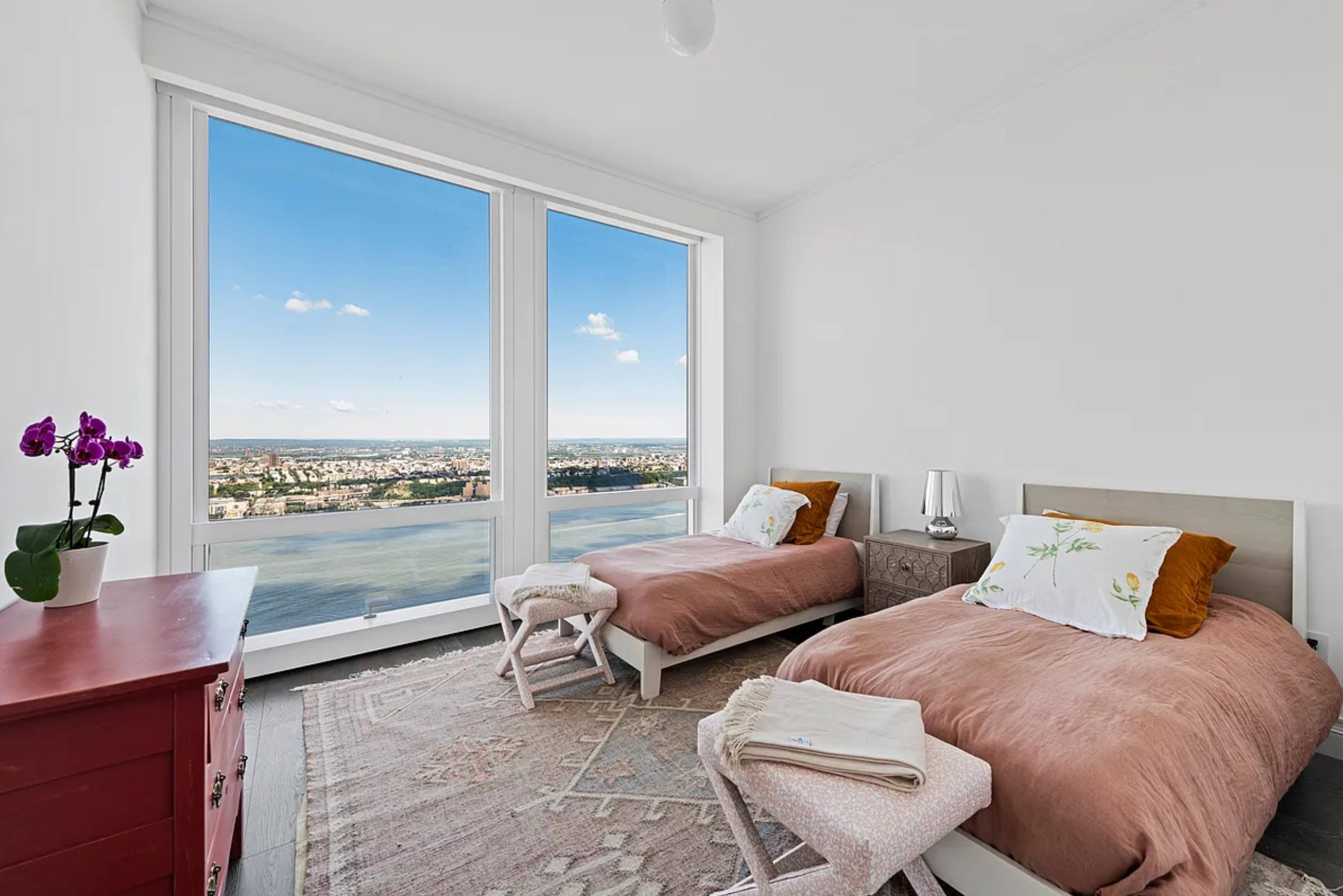 35 Hudson Yards, Unit 6701 Manhattan, NY 10001 - Photo 12 of 23 a living room with furniture and a floor to ceiling window