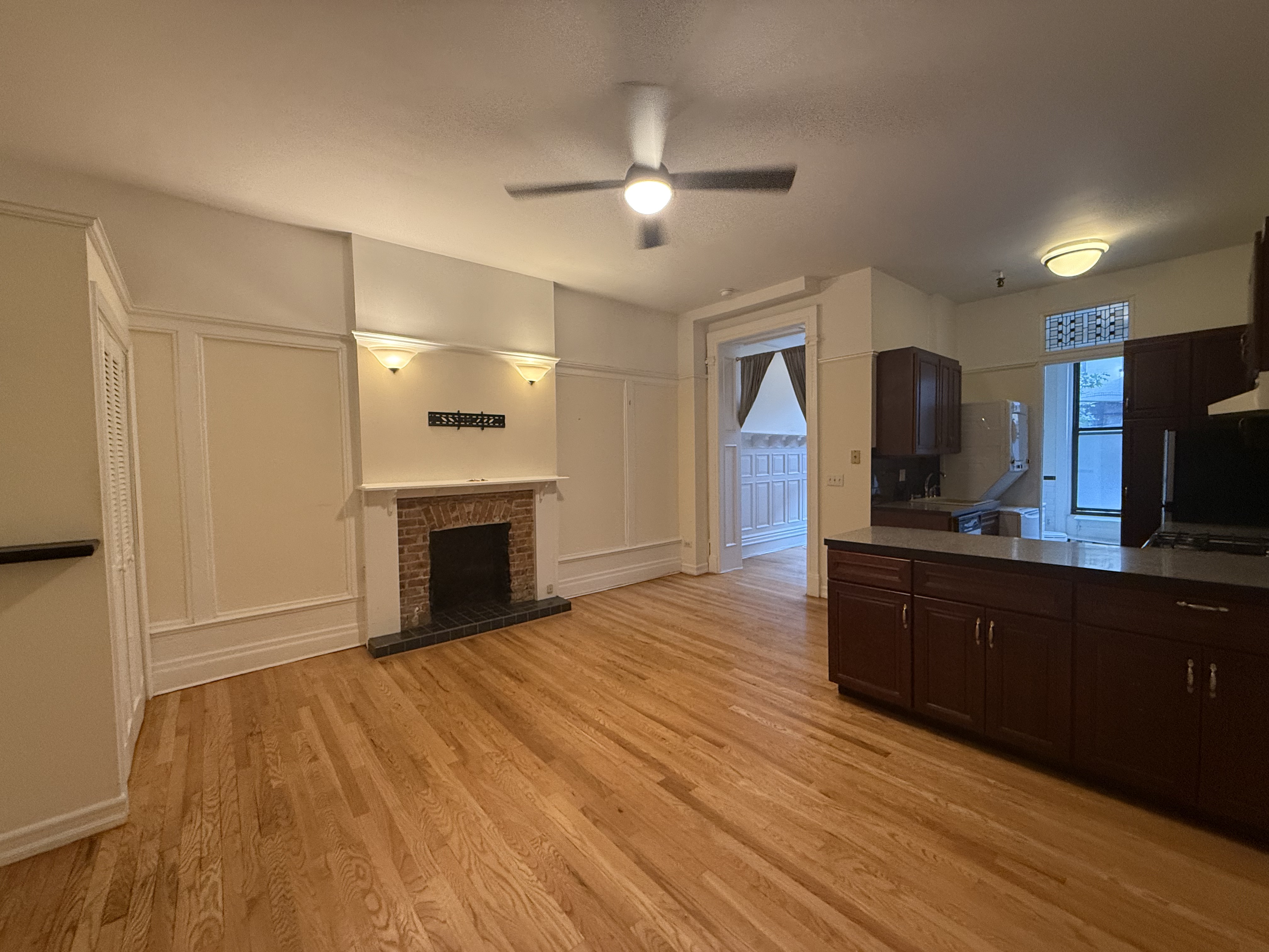 30 Montgomery Place, Unit 2 Brooklyn, NY 11215 - Photo 2 of 17 a view of kitchen and empty room with wooden floor