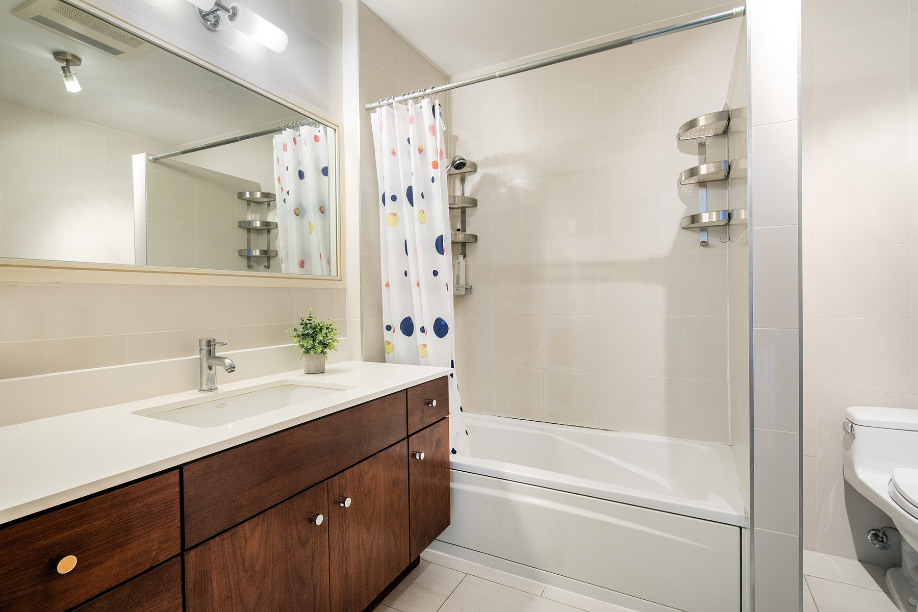 14 Hope Street, Unit 4D Brooklyn, NY 11211 - Photo 5 of 7 a bathroom with a sink a mirror a shower and a mirror