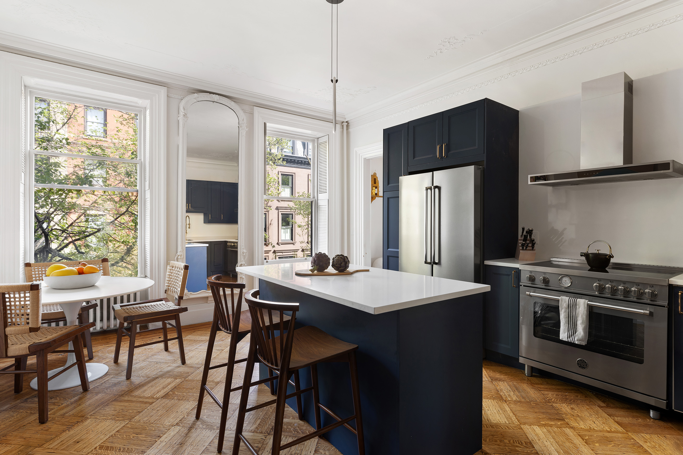 266 Henry Street, Unit B Brooklyn, NY 11201 - Photo 2 of 17 a kitchen with stainless steel appliances granite countertop a stove a refrigerator and a table