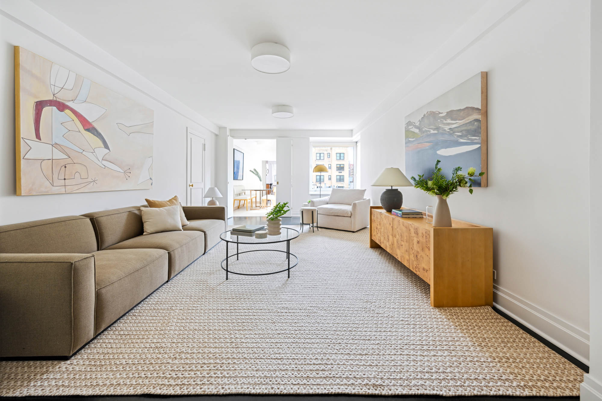 936 5th Avenue, Unit 10AB Manhattan, NY 10021 - Photo 21 of 37 a living room with furniture and wooden floor