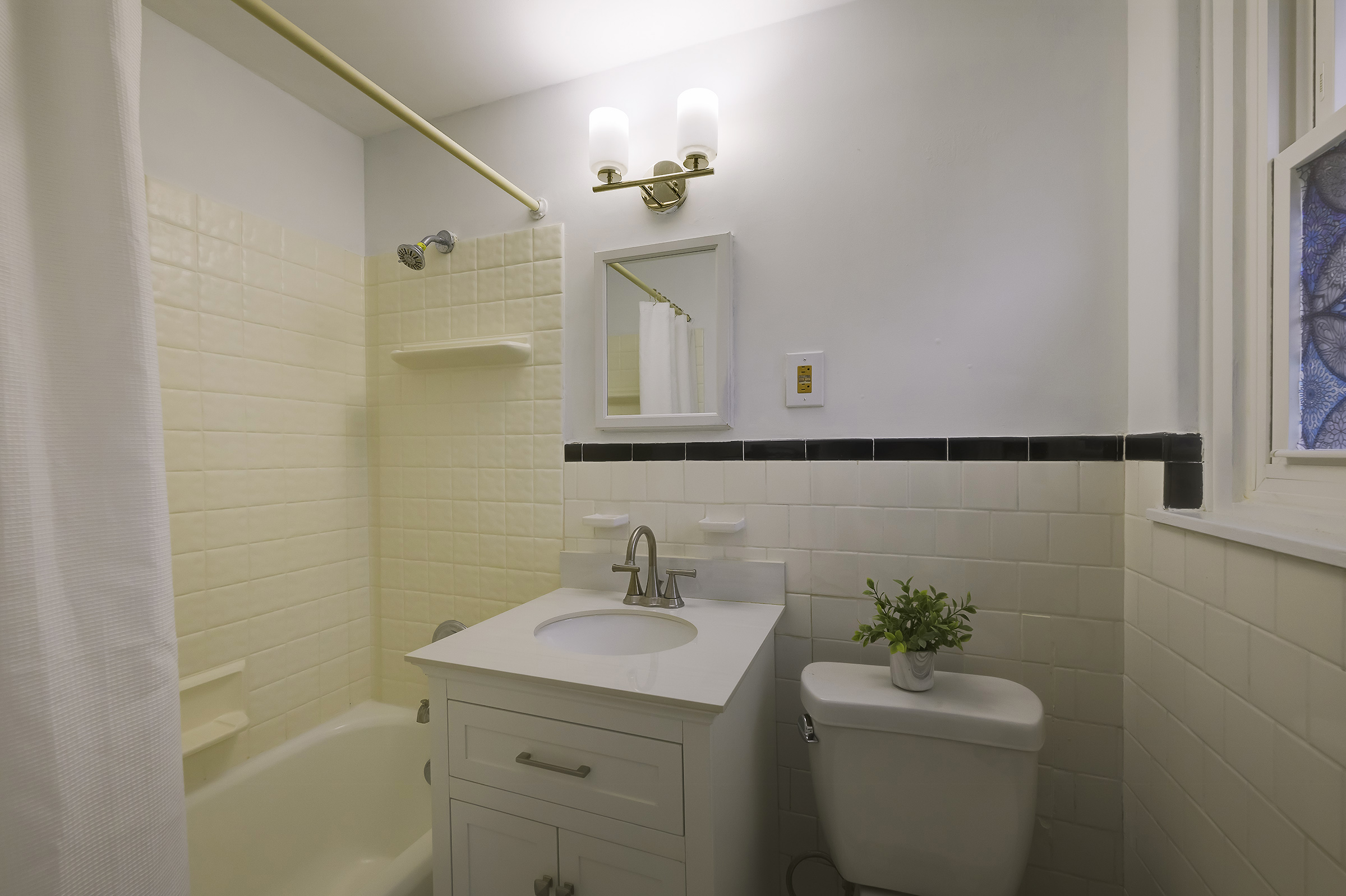 45 D Ridge Road Greenbelt, MD 20770 - Photo 26 of 35 a bathroom with a granite countertop sink toilet and a mirror