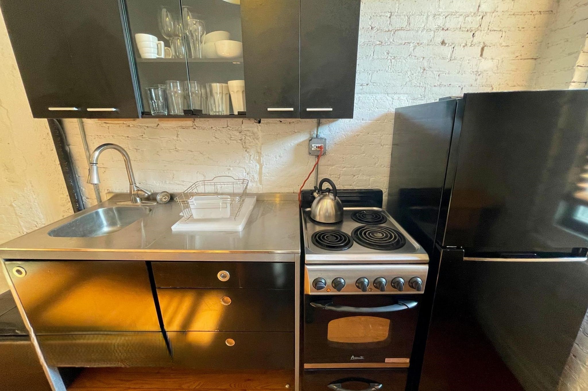 170 Elizabeth Street, Unit 1 Manhattan, NY 10012 - Photo 6 of 16 a bathroom with a sink and a mirror