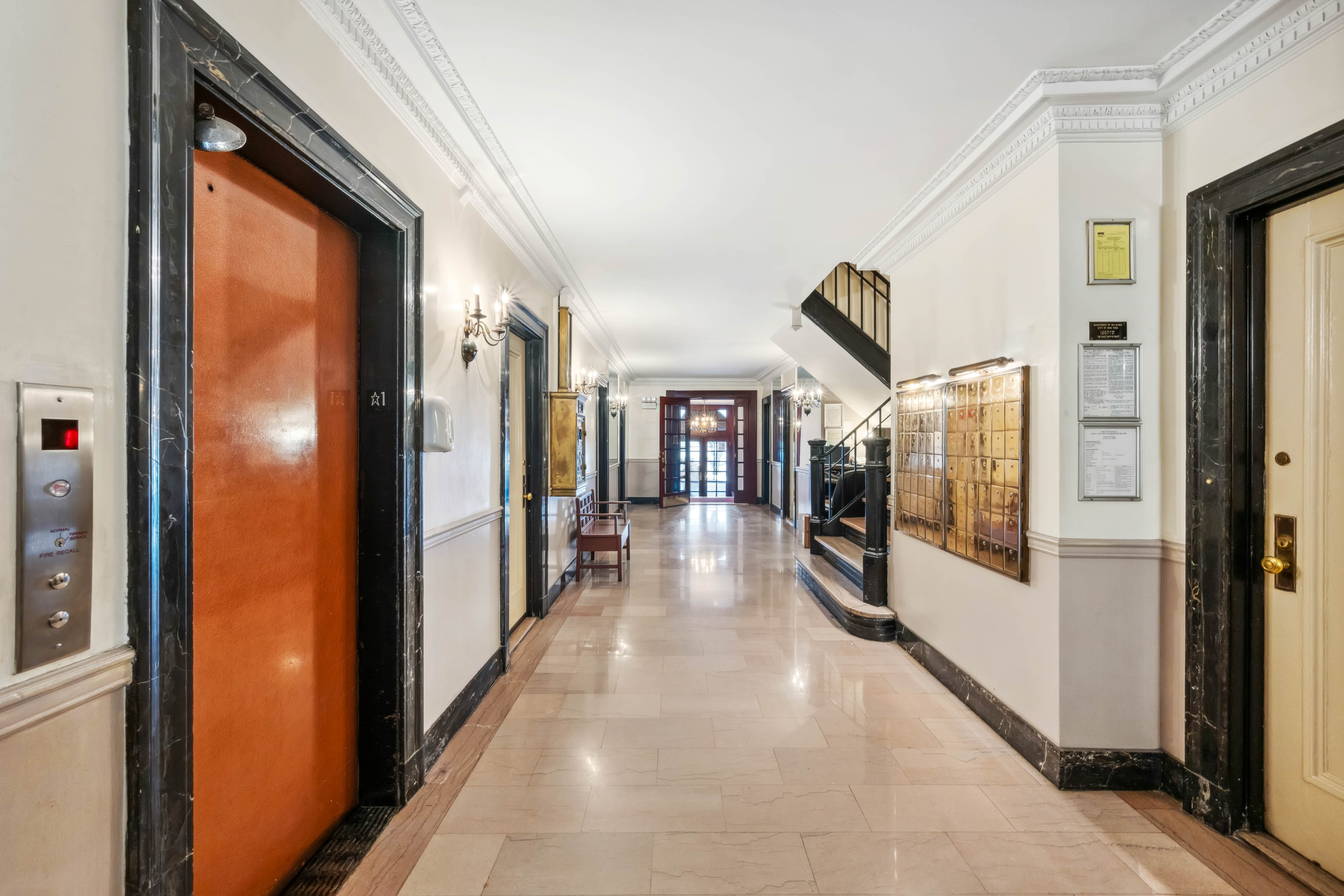 136 East 36th Street, Unit 9/10C Manhattan, NY 10016 - Photo 26 of 27 a view of a hallway with wooden shelves